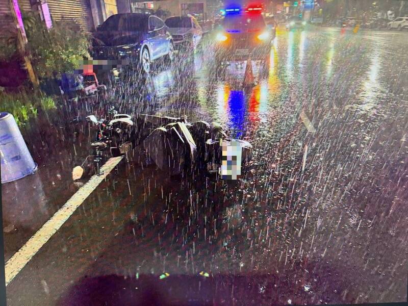 Heavy rain closes Kaohsiung roads, sends two riders to hospital
